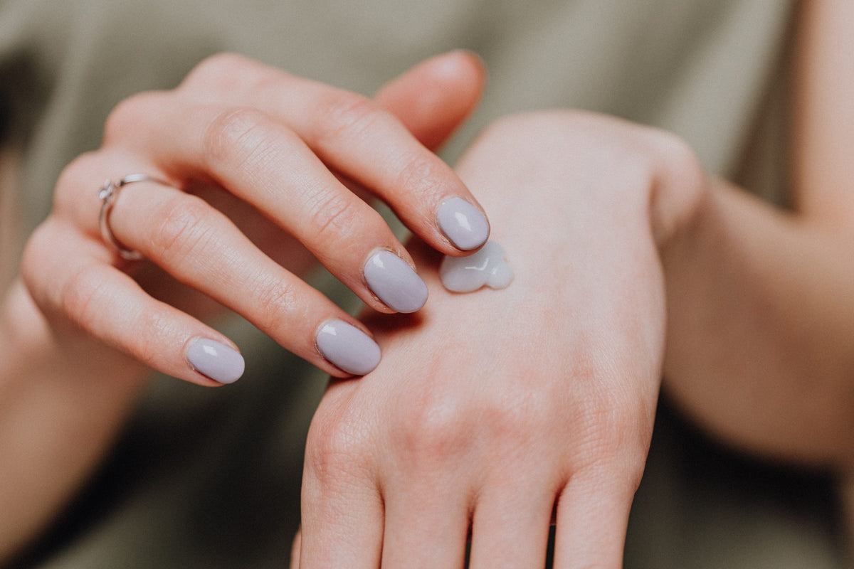 Hand with a dab of moisturizing cream on the knuckles